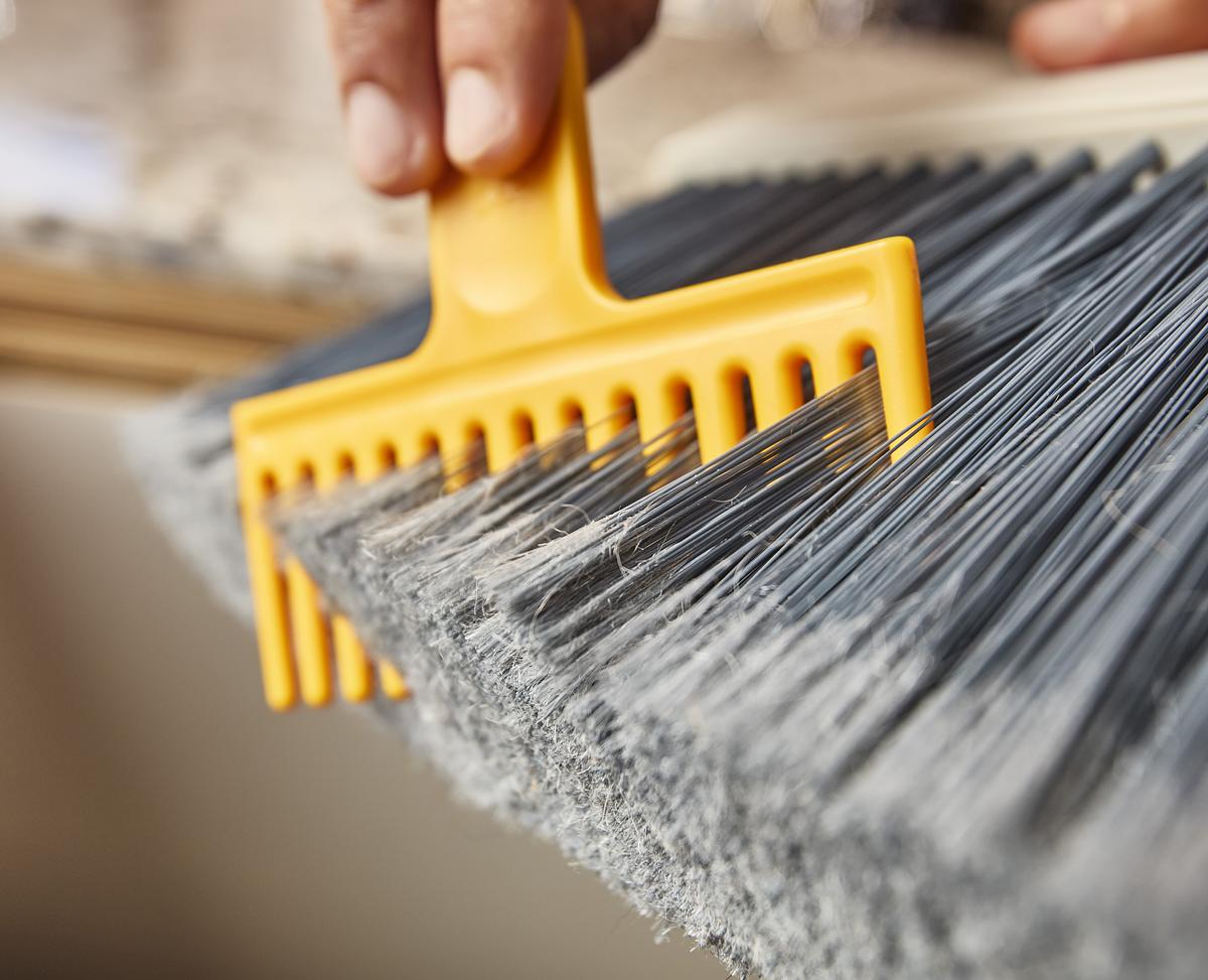 CleanTech™ Wall-Mounted Broom